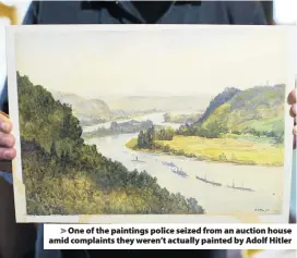  ??  ?? &gt; One of the paintings police seized from an auction house amid complaints they weren’t actually painted by Adolf Hitler