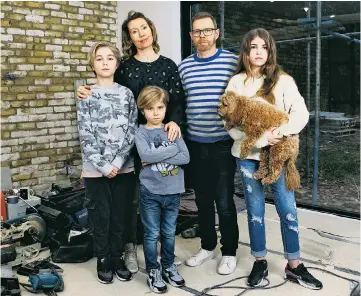  ??  ?? Mark and Wendy Stringer with their children Sonny, Styler and Poppy in their uncomplete­d home in Mill Hill, north London