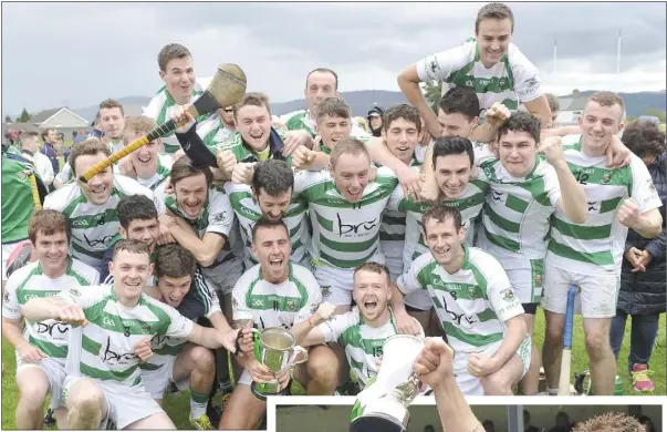  ??  ?? St Fechin’s celebrate their victory, while right, captains, Cormac McAuley and Paddy McCormack raise the Paddy Kelly Cup.