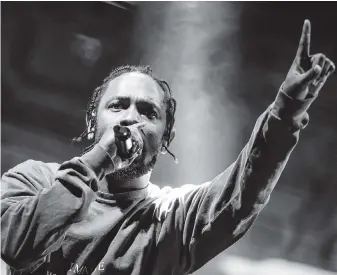  ?? THE ASSOCIATED PRESS ?? Kendrick Lamar performs at FYF Fest in Los Angeles. Lamar’s third official studio album, DAMN., has sold more than one million albums in just three weeks, and has spent all three weeks at No. 1 on Billboard’s 200 albums chart.