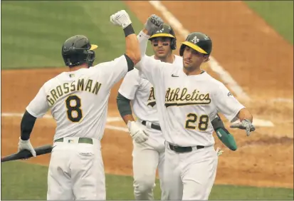  ??  ?? ANDA CHU— BAY AREA NEWS GROUP The A’s Matt Olson (28) celebrates with teammates Robbie Grossman (8) and Ramón Laureano after scoring on a two-run home run in the sixth inning against the Houston Astros on Sept. 10. The Astros would be the ideal choice as a wild-card opponent for the A’s.