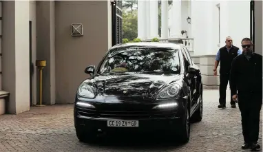  ?? PICTURE: MATTHEWS BALOYI/AFRICAN NEWS AGENCY (ANA) ?? END OF THE ROAD? A luxury SUV leaves the Gupta brothers’ Saxonwold home in Johannesbu­rg as the Asset Forfeiture Unit, Sars and the police serve a search and seizure order.