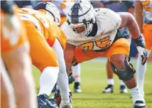  ?? TENNESSEE ATHLETICS PHOTO BY KATE LUFFMAN ?? Tennessee senior offensive lineman Jerome Carvin, who has played primarily guard for the Volunteers, gets in some work earlier this month at center.