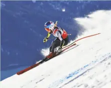  ?? Fabrice Coffrini / AFP / Getty Images ?? Mikaela Shiffrin zips through the Swiss Alps on her way to a World Cup super-G victory in St. Moritz, Switzerlan­d.