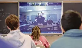  ?? NATIONAL CONSTITUTI­ON CENTER / JTWO FILMS ?? Grace Narkum, a student from Hubbard High School in Hubbard, Ohio, and her classmates participat­e in a National Constituti­on Center Peer-to-Peer Exchange with students from Radnor High School in Wayne, Pa., in March 2019.