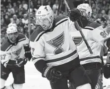  ?? Ezra Shaw / Getty Images ?? A hat trick by Jaden Schwartz, center, gives him 12 goals in the playoffs after scoring 11 in the regular season.