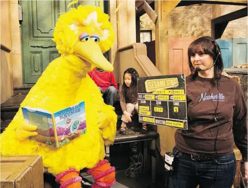  ?? MARK LENNIHAN / THE ASSOCIATED PRESS FILES ?? Above, Lynn Finkel, stage manager for Sesame Street slates a taping with Big Bird in New York. The puppeteer who has played Big Bird on Sesame Street is retiring after nearly 50 years on the show. Caroll Spinney, left, tells the New York Times that Thursday, will be his last day on the program, which he joined from the start in 1969. The 84-year-old was also Oscar the Grouch.