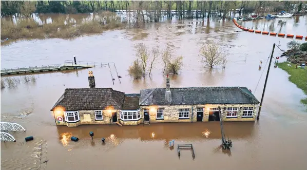  ?? ?? Naburn Lock, on the outskirts of York, was flooded yesterday as stormy weather struck the city, causing the River Ouse to rise. Weather experts have warned that Storm Jocelyn may cause more damage than Storm Isha