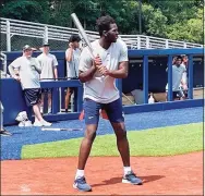  ?? Mike Anthony / Hearst Connecticu­t Media ?? UConn sophomore forward Adama Sanogo takes an at-bat during the Huskies’ recreation­al softball game Wednesday at Burrill Family Field.