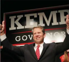  ?? JOHN BAZEMORE — THE ASSOCIATED PRESS ?? Georgia Republican gubernator­ial candidate Brian Kemp gives a thumbs-up to supporters, Wednesday in Athens, Ga.