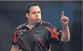  ??  ?? Adrian Lewis celebrates during his match against Magnus Caris during day five of the William Hill World Darts Championsh­ip in London.