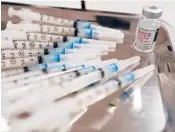  ?? MARY ALTAFFER/AP ?? Syringes with Moderna COVID-19 vaccine at a pop-up site in the Queens borough of New York City.