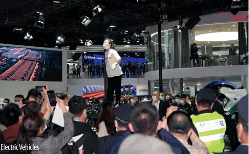  ??  ?? A Tesla owner protests on top of a Tesla Model 3 at Auto Shanghai, April 19, 2021
