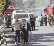  ?? AP PHOTOS ?? CASUALTIES: The suicide bombing in Kabul left at least 90 people dead and more than 400 injured, including a local TV news cameraman, below.