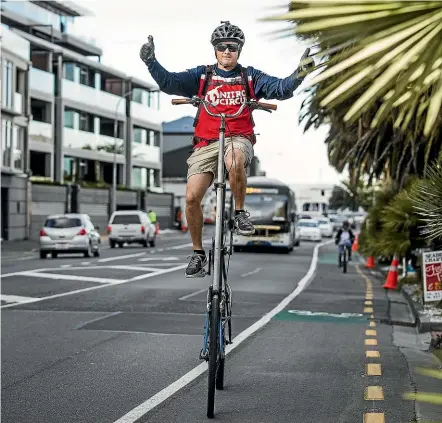  ?? BRADEN FASTIER/STUFF ?? Chris Ratcliffe rides his custom-made tall bike to work along Rocks Rd, Nelson. He says it is much safer than a regular bicycle because the rider is able to see a lot more and is more visible to drivers.