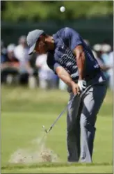  ?? FRANK FRANKLIN II — THE ASSOCIATED PRESS ?? Tiger Woods hits an approach shot on the fourth hole during the first round of the U.S. Open on Thursday.