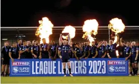  ?? Leigh. Photograph: Tim Goode/PA ?? Wigan players celebrate winning the League Leaders' Shield after a tense victory against