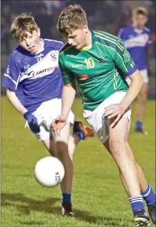  ??  ?? Cillian Doyle of Our Lady’s Island/St. Fintan’s is pursued by Shane Doran (Oylegate-Glenbrien).