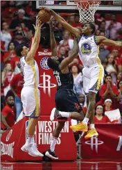  ?? NHAT V. MEYER — BAY AREA NEWS GROUP ?? The Warriors’ Klay Thompson (11) and Kevon Looney (5) defend against the Rockets’ James Harden in the first quarter of Game 7of the Western Conference finals at the Toyota Center in Houston in May 2018.