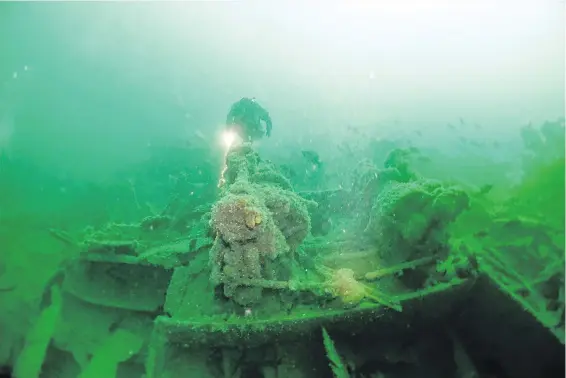  ??  ?? Jacques Marc swims over the stern winches on the wreck of the SS Princess Sophia.