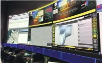  ?? Ramola Talwar / The National ?? Dubai Civil Defence control room is equipped with screens that show live feeds and data from buildings.