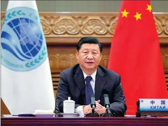  ?? LI XUEREN / XINHUA ?? President Xi Jinping addresses the 20th Meeting of the Council of Heads of State of the Shanghai Cooperatio­n Organizati­on via video link from Beijing on Tuesday.