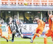  ??  ?? Opener Dundee Utd’s Mark Duran (4) scores