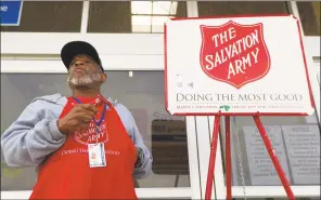  ?? Jason Fochtman / Hearst Connecticu­t Media ?? Salvation Army volunteer bell ringer Mike Friend rings a bell outside of Walmart in The Woodlands, Texas.