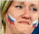  ?? AP ?? A Russian fan in tears after the shootout loss against Croatia.