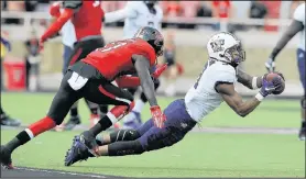  ??  ?? TCU wide receiver Josh Doctson (9) catches a pass against Texas Tech defensive back Thierry Nguema (17).