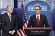  ?? CAROLYN KASTER - THE ASSOCIATED PRESS ?? Treasury Secretary Steven Mnuchin, joined by National Economic Director Gary Cohn, speaks in the briefing room of the White House in Washington, Wednesday. President Donald Trump is proposing dramatical­ly reducing the taxes paid by corporatio­ns big and...