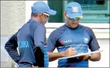  ??  ?? Marvan Atapattu and Chaminda Vaas having a discussion on the eve of Sri Lanka ICC World Cup Group Stage match against Afghanista­n on Sunday.