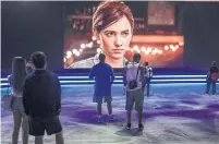  ?? IRFAN KHAN/TRIBUNE NEWS SERVICE ?? Fans watch a demo of the breathtaki­ngly beautiful — and violent — Last of Us 2, one of many new games featuring female leads.