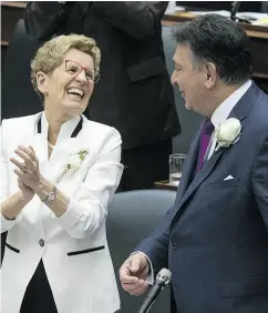  ?? CRAIG ROBERTSON / POSTMEDIA NEWS FILES ?? Ontario Premier Kathleen Wynne and Finance Minister Charles Sousa at the reading of the budget last month.