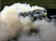  ?? MIKE MCCARN — THE ASSOCIATED PRESS ?? Kyle Larson does a burnout after winning the NASCAR AllStar Race at Charlotte Motor Speedway in Concord, N.C., Saturday.