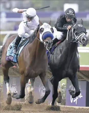  ?? Denis Poroy/Associated Press ?? Jockey Flavien Prat, left, rides Battle of Midway to victory Friday ahead of Sharp Azteca, ridden by Paco Lopez, in the Las Vegas Dirt Mile race at the first day of the Breeders' Cup.