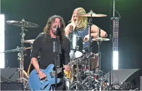  ?? ROBERT HANASHIRO/USA TODAY ?? Dave Grohl returns to the Hall with Foo Fighters.