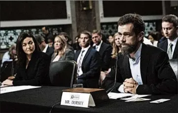  ?? DREW ANGERER/GETTY ?? Facebook COO Sheryl Sandberg, left, and Twitter’s CEO Jack Dorsey testify before a Senate intelligen­ce panel this month.