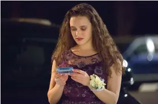  ?? Netflix ?? Acress Katherine Langford is shown in a scene from the series “13 Reasons Why,” about a teenager who commits suicide. The stomach-turning suicide scene has triggered criticism from some mental health advocates that it romanticiz­es suicide and even...