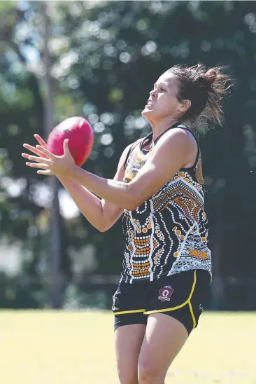  ?? Pictures: BRENDAN RADKE ?? WEAPON: Tigers' Jade Kennedy takes an unconteste­d mark.