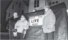  ?? COLIN CHISHOLM ?? From left, Jennifer Dill, Donna Eldridge, and Kathy Riley, volunteers with Harvest House in Windsor, wait out in the cold, collecting donations for the organizati­on Nov. 15.