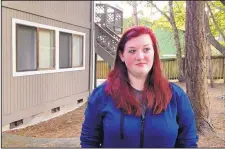  ?? MARTHA BELLISLE/ASSOCIATED PRESS ?? Amber Cathey, next-door neighbor and former high school classmate of Cascade Mall shooting suspect Arcan Cetin, stands in front of their building. She said he was “creepy, rude and obnoxious.”