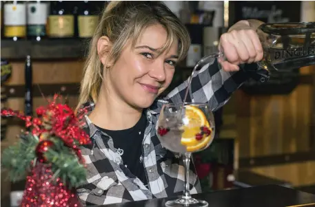  ??  ?? Eva Reingraber (above) mixes a festive gin & tonic at Dingle Whiskey Bar, Nassau St, Dublin; (left) Gary McLoughlin of Glendaloug­h Gin forages for flora in the Wicklow mountains