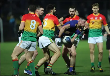  ??  ?? Wicklow’s Podge O’Toole is swallowed up by the swarming Carlow defence.