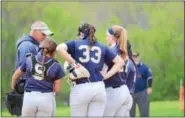  ??  ?? Spring-Ford head coach Tim Hughes meets with his team at the pitching circle during the Rams’ 8-0 victory over Pottsgrove.