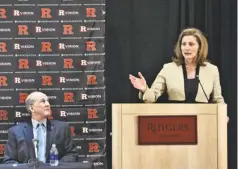  ?? MICHAEL KARAS, AP Rutgers President Robert Barchi, left, introduced Julie Hermann as Rutgers athletics director May 15, replacing Tim Pernetti. ??