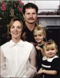  ?? AP ?? John A. Chapman is shown with his wife, Valerie, left, and daughters Madison, 5, and Brianna, 3, before his 2002 death.