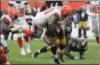  ?? TIM PHILLIS — THE NEWS-HERALD ?? Browns defensive lineman Chris Smith tries to bring down Steelers running back James Conner on Sept. 9 at FirstEnerg­y Stadium.