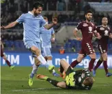  ?? — AP ?? Torino goalkeeper Joe Hart saves on Lazio’s Marco Parolo in Rome on Monday.