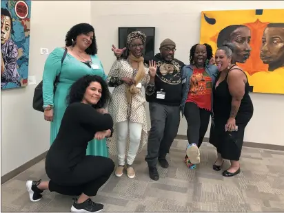  ?? COURTESY OF EDGAR-ARTURO CAMACHO ?? Artists featured at the Cal Maritime Anchor Center Black History Month exhibit pose on Friday night.